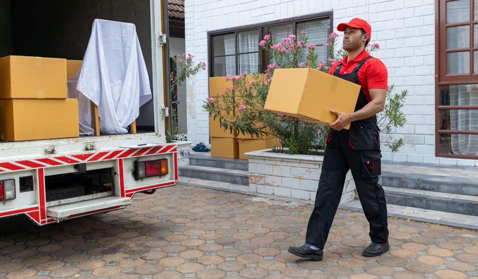 portrait of movers loading boxes crop